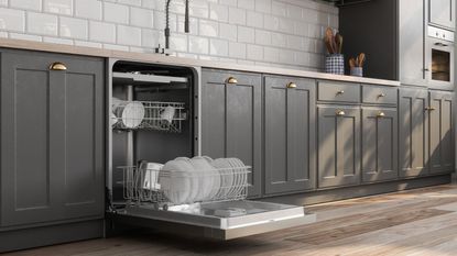 An open dishwasher in a grey modern kitchen