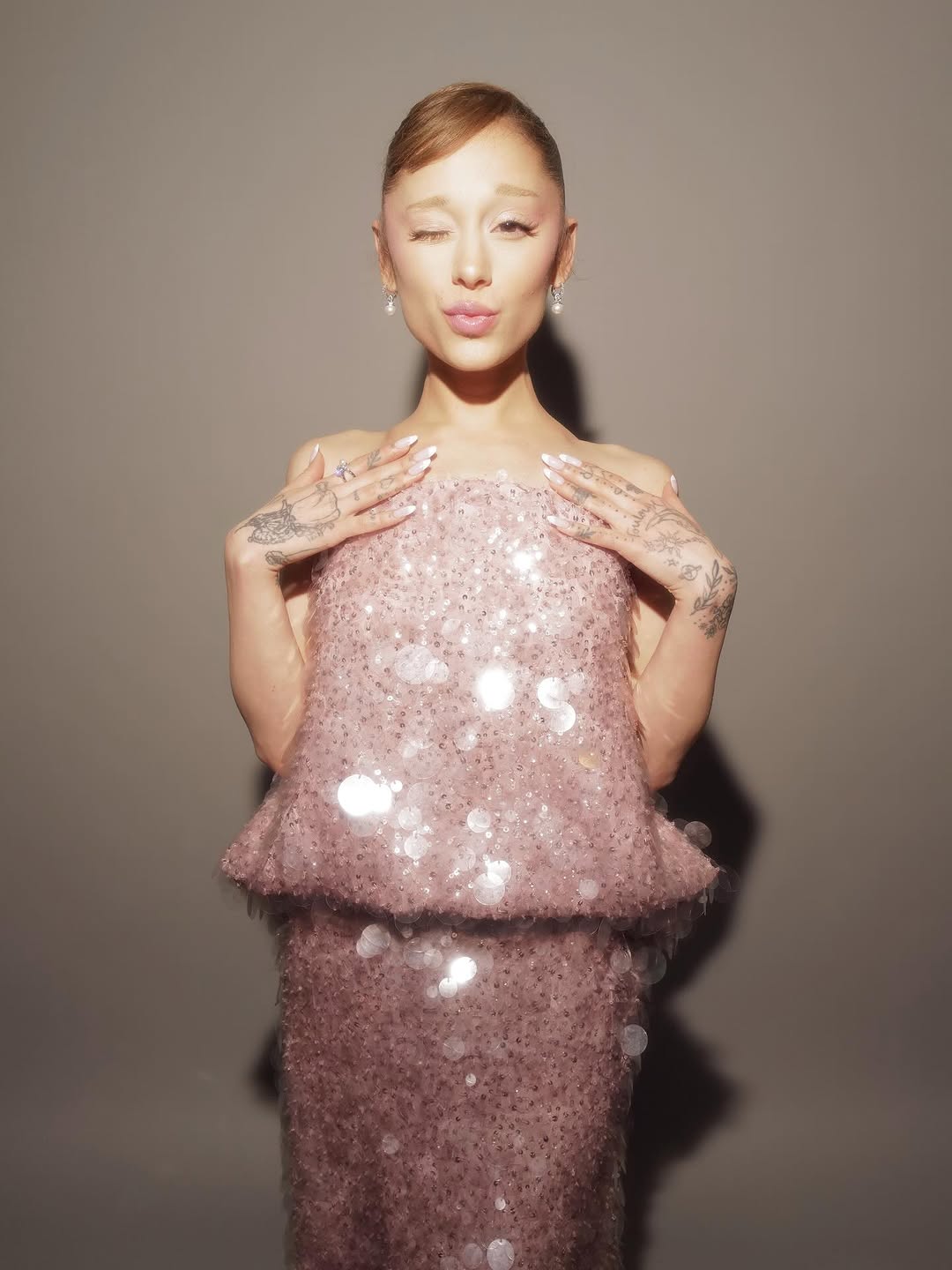 Ariana Grande wore a custom Balenciaga gown made of pink sequins on the Wicked: For Good press tour