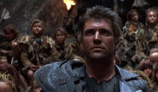 Mad Max Beyond Thunderdome Mel Gibson stands defiant in front of the children