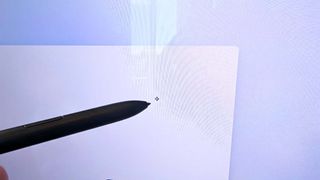 S Pen hovering over the Samsung Galaxy Book5 Pro 360 screen and a cursor showing up on the display.