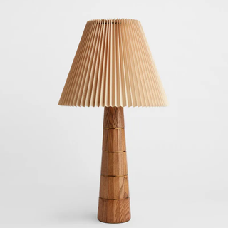 tall table lamp with pleated shade and tapered wooden base