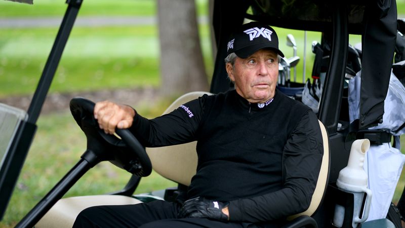 Gary Player drives a golf cart