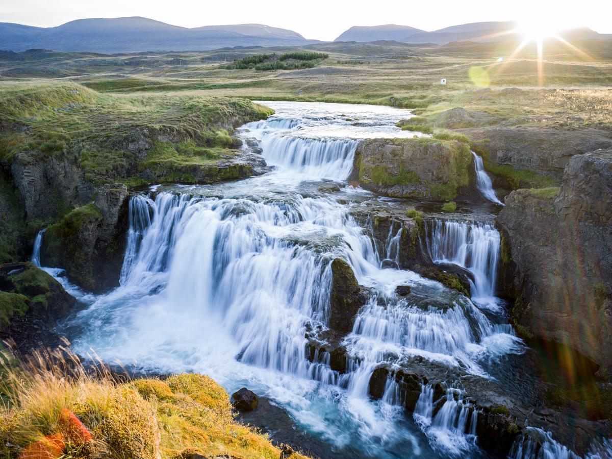 full waterfalls flowing in iceland in the fall