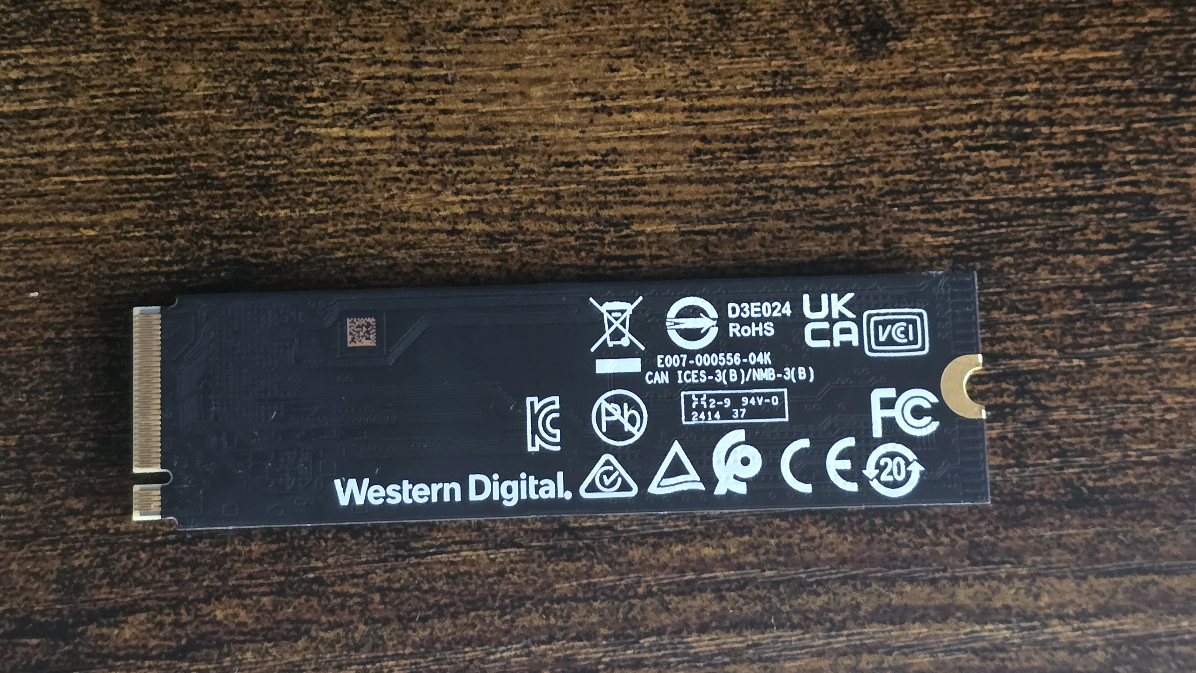 A WD SN5000 SSD out of its box and installed in a PC's NVMe slot.