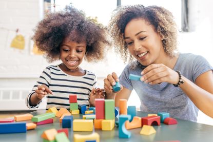 Woman toddler playing together