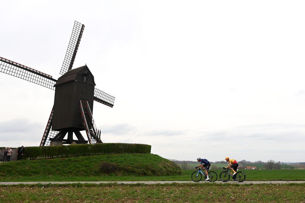 WAREGEM BELGIUM MARCH 29 A general view of Oier Lazkano Lopez of Spain and Movistar Team and Alexander Kristoff of Norway and UnoX Pro Cycling Team compete in the breakaway passing through a Huisepontweg cobblestones sector during the 77th Dwars Door Vlaanderen 2023 Mens Elite a 1837km one day race from Roeselare to Waregem DDV23 on March 29 2023 in Waregem Belgium Photo by Tim de WaeleGetty Images