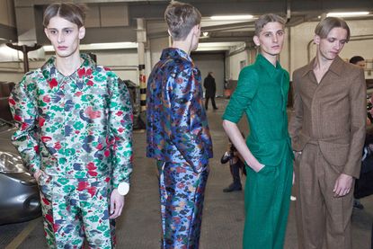 Four people in a Car Park who look ready for a photoshoot