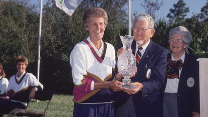 USA captain Kathy Whitworth victorious with trophy and Karsten Solheim