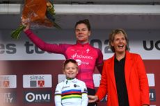 ARNHEM NETHERLANDS OCTOBER 13 Lotte Kopecky of Belgium and Team SD Worx Protime puts on the Purple UCI Womens WorldTour Leader Jersey on the podium ceremony after the 26th Simac Ladies Tour 2024 Stage 6 a 1458km stage from Arnhem to Arnhem UCIWWT on October 13 2024 in Arnhem Netherlands Photo by Luc ClaessenGetty Images