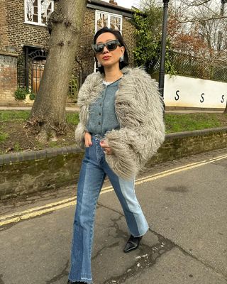 Lisa Marinelli wearing jeans and a shaggy coat