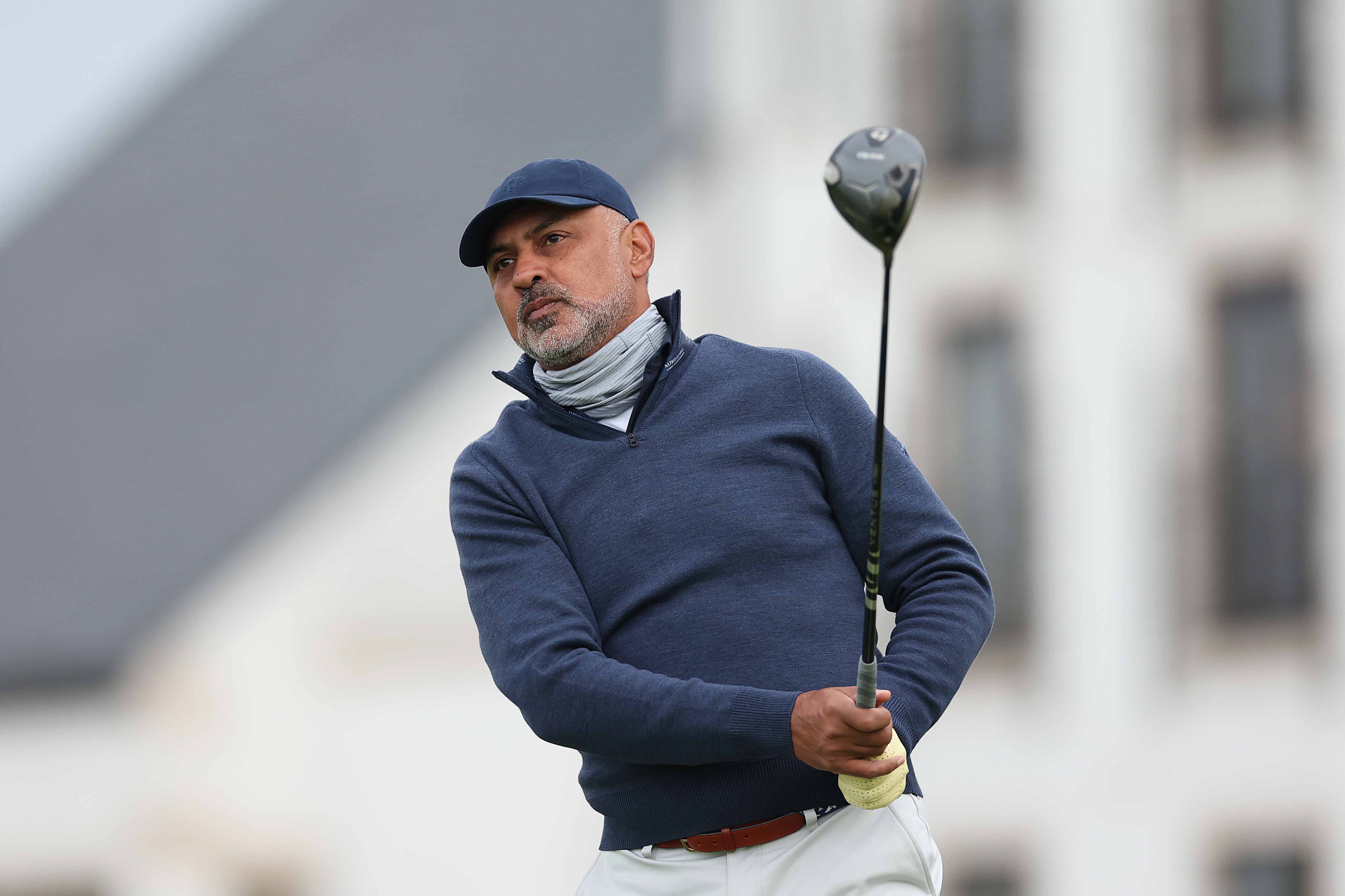 Nikesh Arora holds his finish on a drive