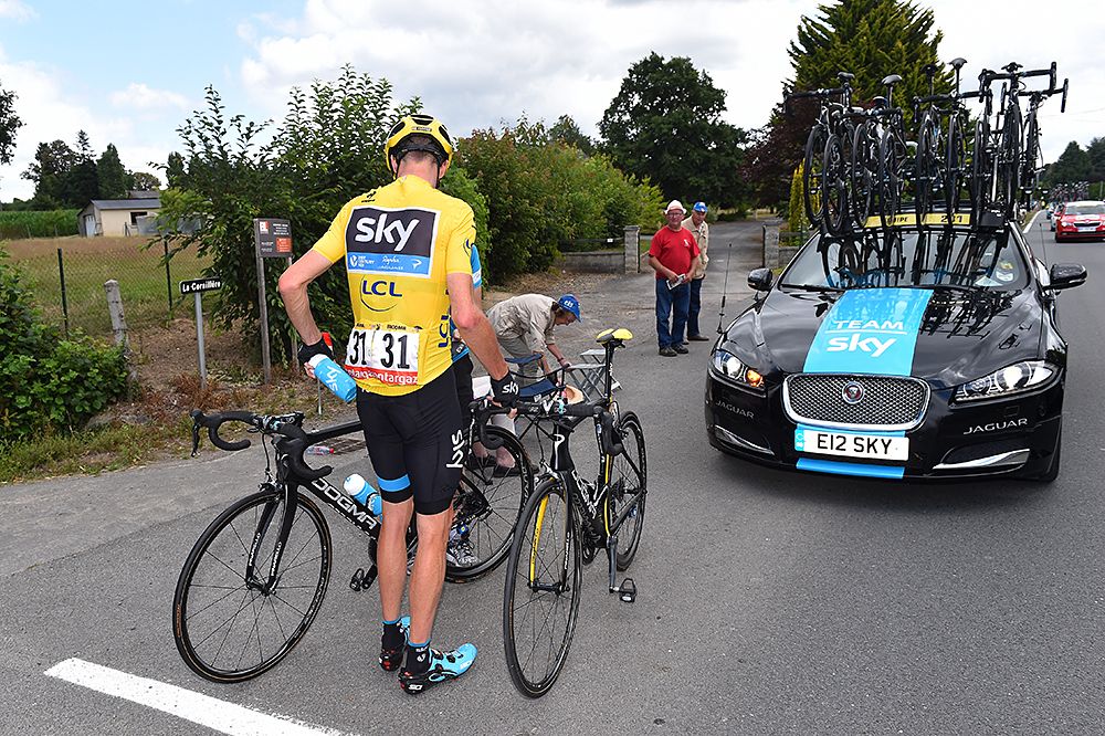 Yellow jersey Chris Froome (Team Sky) changes bikes during stage 8