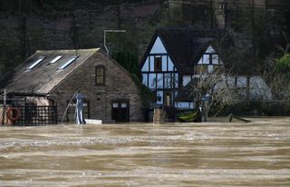 Homes surrounded by flood water from the River Severn after successive storms hit the UK on February 22, 2022 in Ironbridge, England