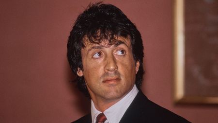 sylvester stallone on a red background