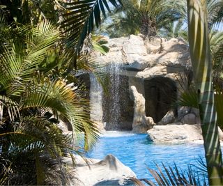 Swimming pool grotto with waterfall