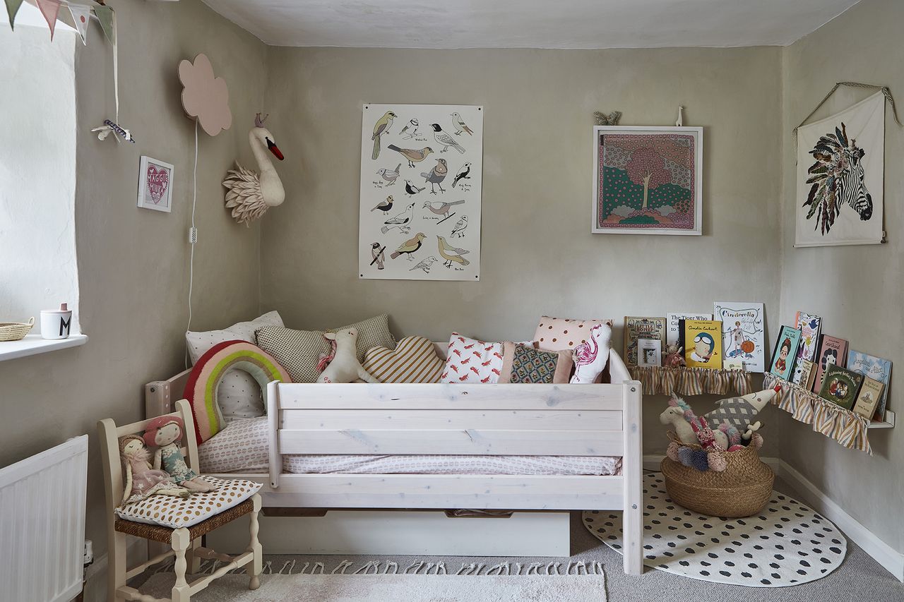 neutral children&#039;s room with artwork