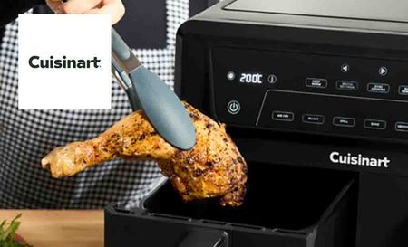 Cuisinart logo placed over an image of a woman taking out a fried chicken leg from an air fryer