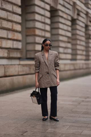 woman in blazer and jeans