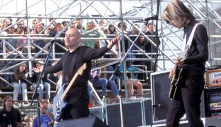 Billy Corgan (left) and James Iha perform with Smashing Pumpkins at the Tibetan Freedom Concert in 1996