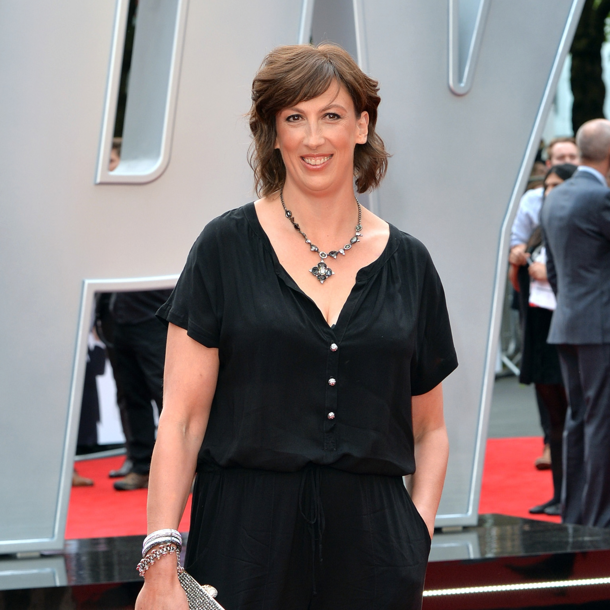 Miranda Hart in black shirt and trousers at premier.