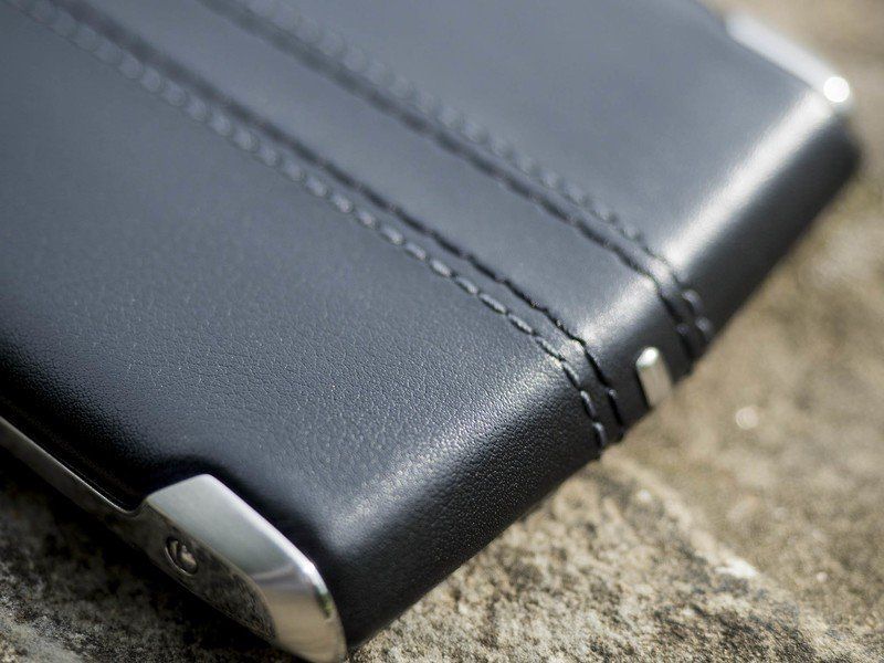 The leather wraps around the bottom, with metal protection at the corners and points