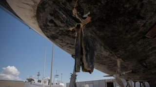 A picture of the underside of the boat that was attacked last week shows extensive damage to the hull.