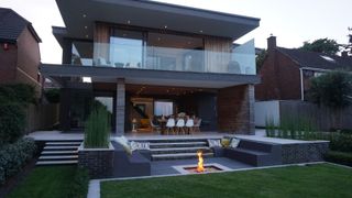 modern zoned garden design with conversation pit and patio dining area