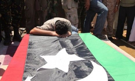 A man mourns during the burial of Libya&amp;#039;s rebel military commander Gen. Abdel Fattah Younes