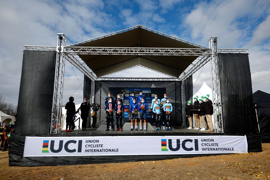 FAYETTEVILLE GEORGIA JANUARY 28 LR Eric Brunner of The United States Katie Clouse of The United States Clara Honsinger of The United States Scott Funston of The United States on second place race winner Samuele Leone of Italy Silvia Persico of Italy Lucia Bramati of Italy Davide Toneatti of Italy and Daan Soete of Belgium Kiona Crabbe of Belgium Alicia Franck of Belgium and Niels Vandeputte of Belgium on third place pose on the podium during the podium ceremony after the 73rd UCI CycloCross World Championships Fayetteville 2022 Team Relay Fayetteville2022 on January 28 2022 in Fayetteville Georgia Photo by Chris GraythenGetty Images