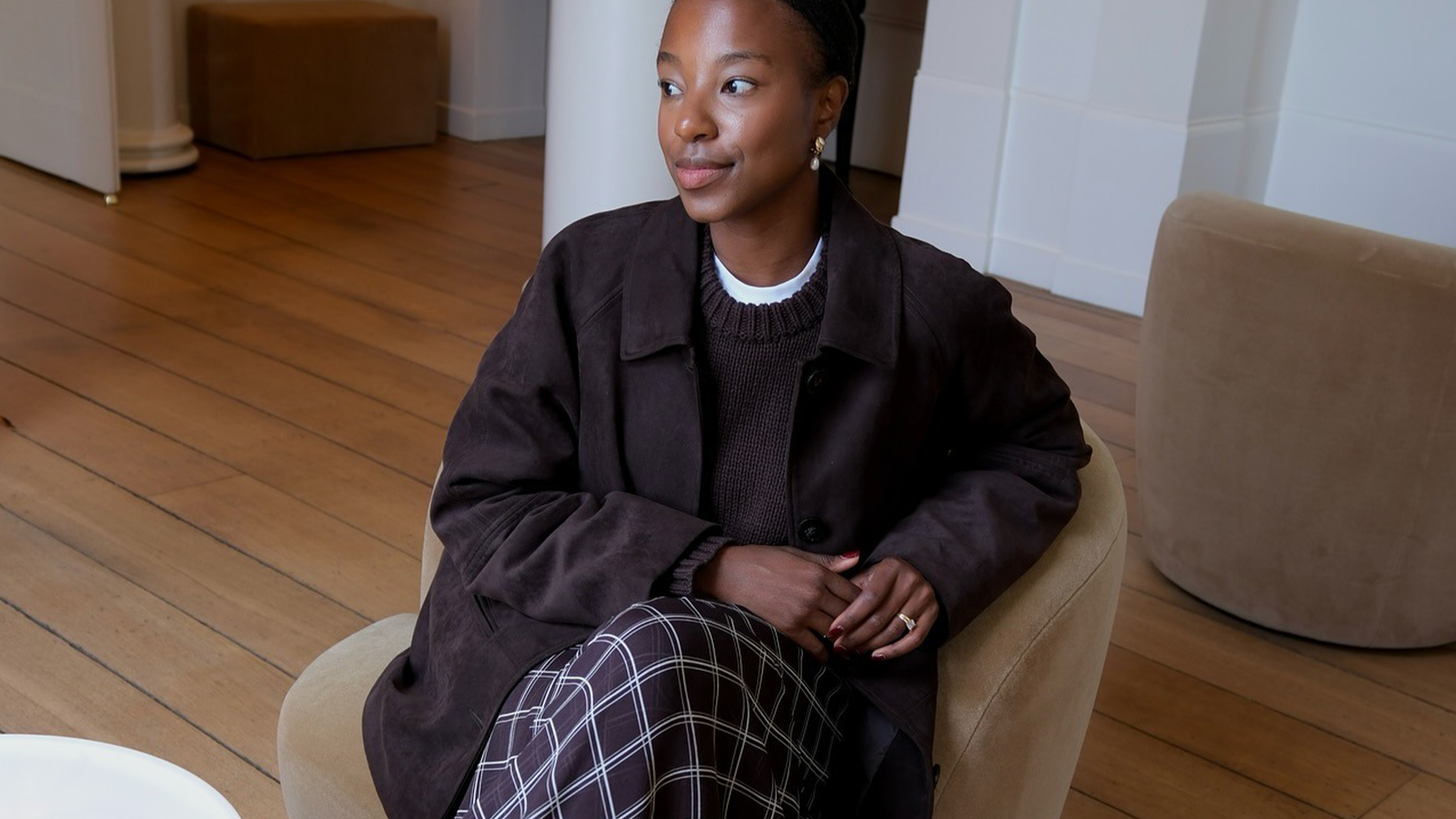 Influencer wearing plaid maxi skirt.
