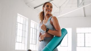 Woman with yoga mat