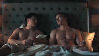 Shane and Ilya in bed talking in Episode 2