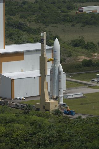 Ariane 5 VA 213 stands ready for transfer from the Final Assembly Building to the launch pad, June 4, 2013. This image was released April 4, 2013