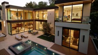 Qualcomm Wi-Fi 8 lifestyle image showing people using wireless devices around a house