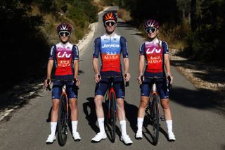 Urška Žigart, Mauro Schmid and Matilde Vitillo pose in the Jayco-Alula and Liv-Alula team kit for 2024