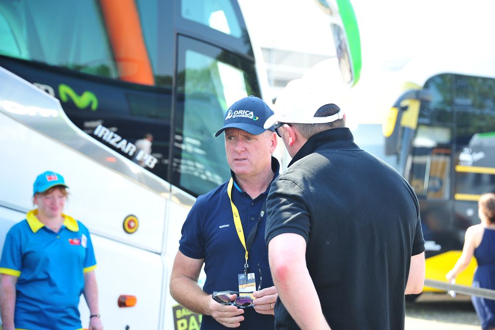 Orica GreenEdge staff chat before the stage.