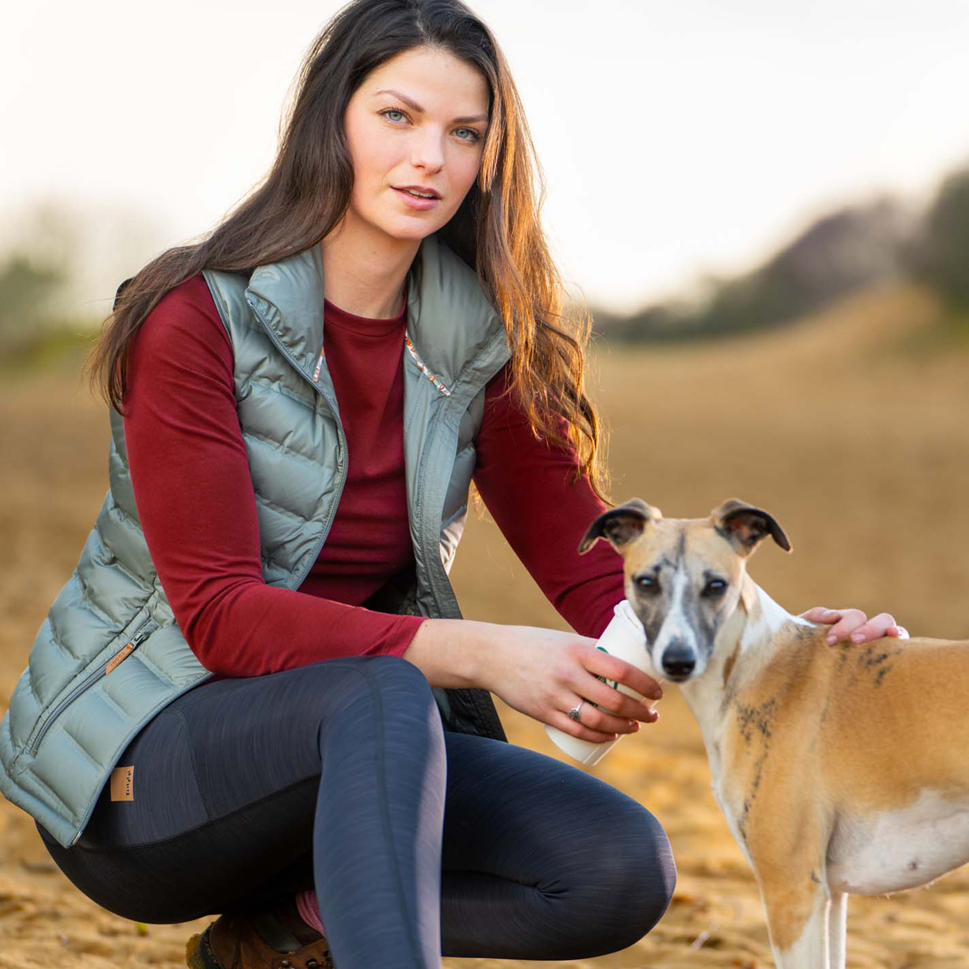 toggi-womens-rural-padded-gilet-green-vista-top-red-roam-hiking-tights-black-lifestyle-008