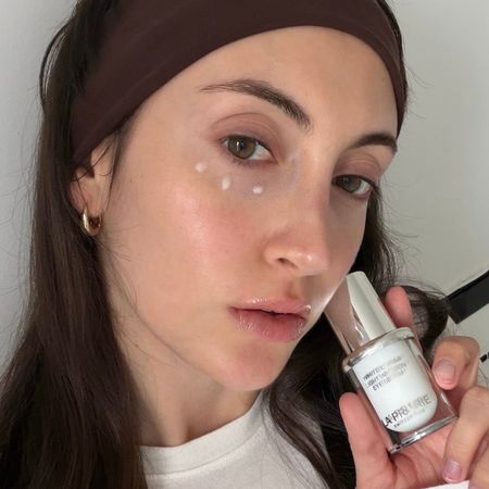 Who What Wear associate beauty editor Alyssa Brascia holding eye creams.
