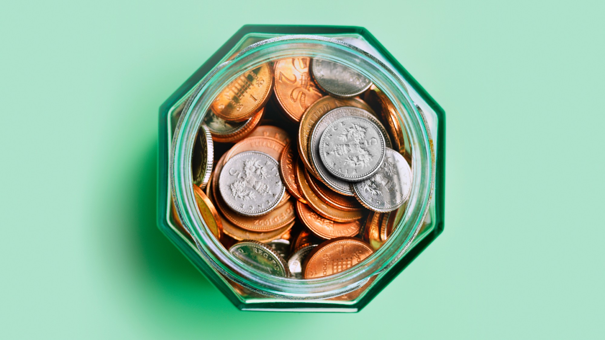 An aerial view of a jar of UK coins