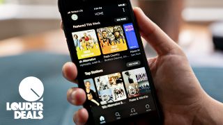 Amazon Music Unlimited: Hand holding a phone playing Amazon Music Unlimited
