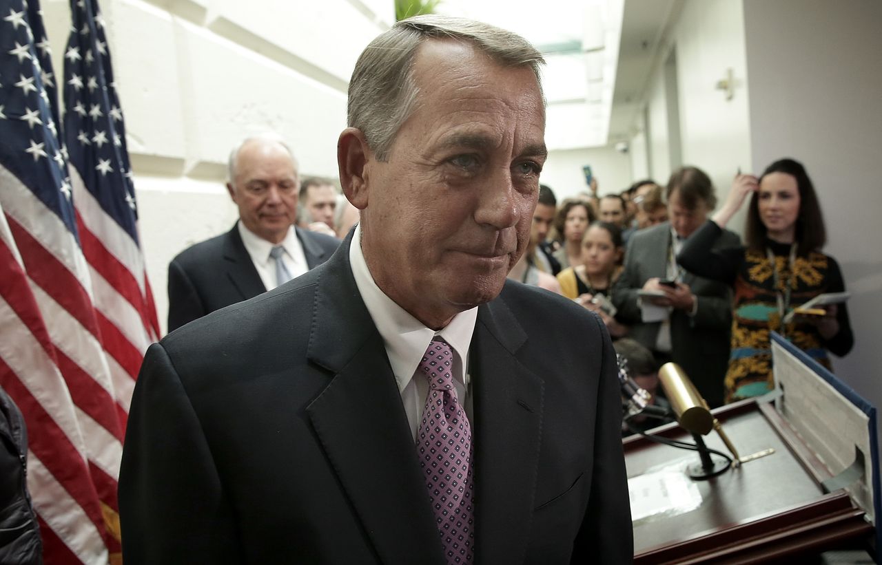 Boehner departs a press conference.