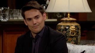 Mark Grossman as Adam Newman smirking in The Young and the Restless