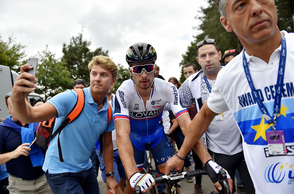 A fan gets a selfie with Peter Sagan after the finish