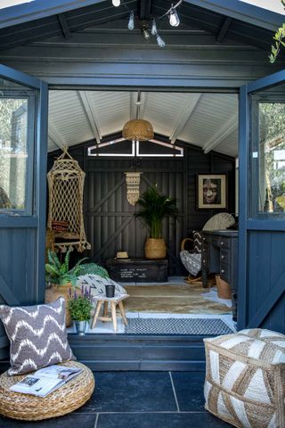 modern she shed idea with hanging chair