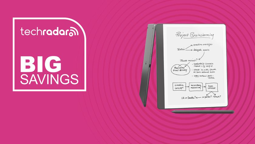 The Amazon Kindle Scribe on a pink background with text saying Big Savings.
