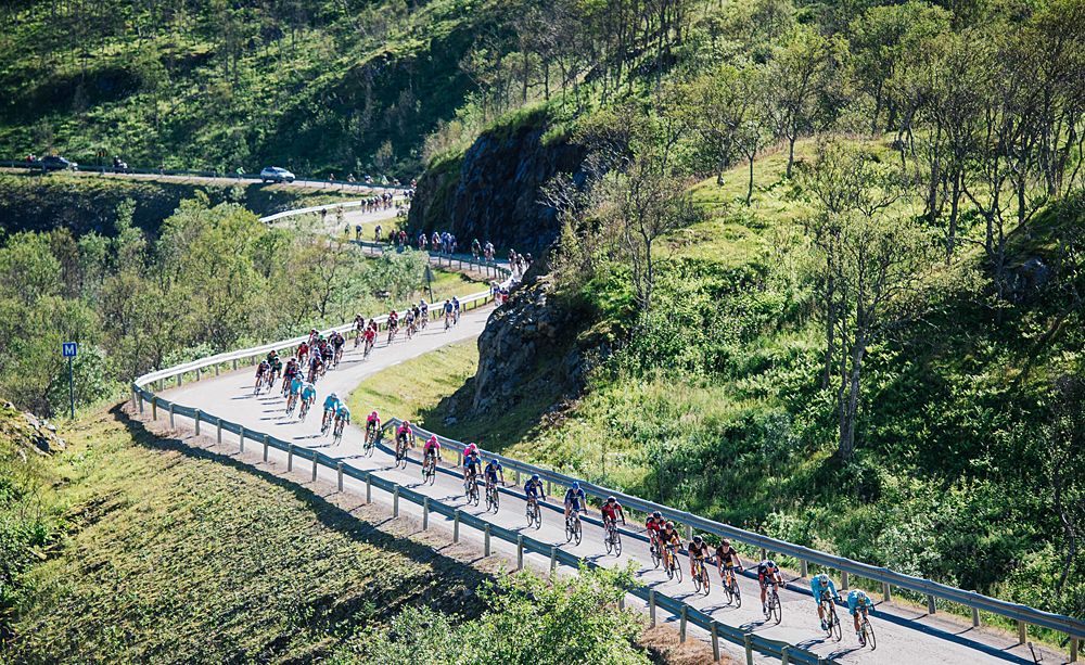 The peloton twists and turns through scenic landscape at the Arctic Race of Norway