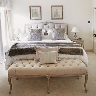 master bedroom with carpet and headboard