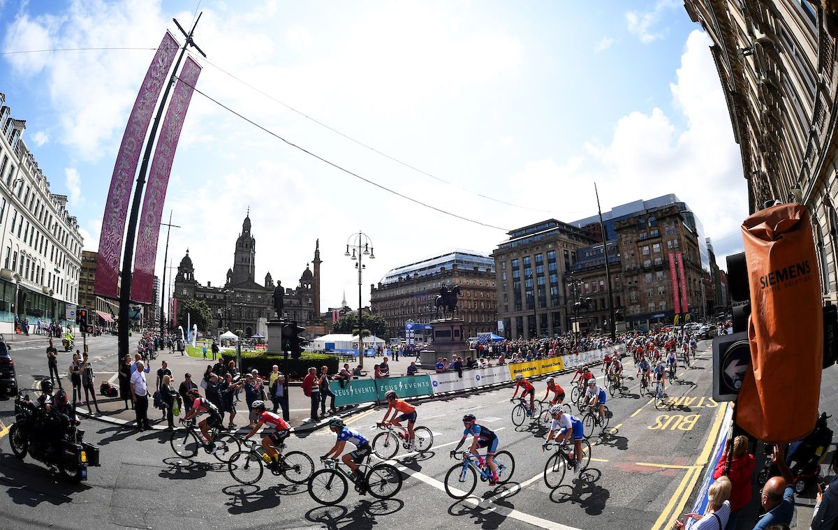 The peloton roll out of George Square, Glasgow.
