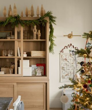 bookshelves decorated for christmas in a playroom at Shea McGee's home