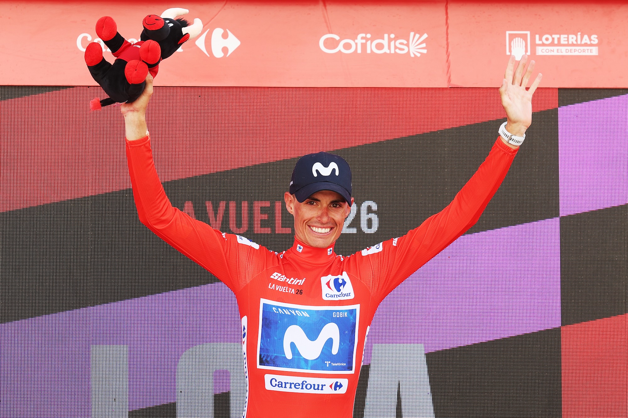 Enric Mas of Movistar Team holds the red jersey headed to final rest day